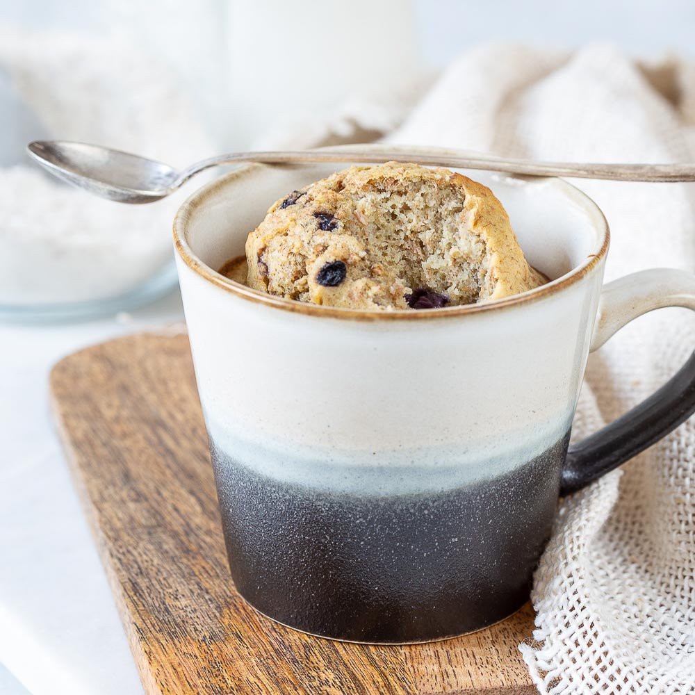 banana oatmeal mug cake with blueberries
