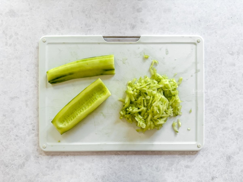 Clean the cucumber and grate it