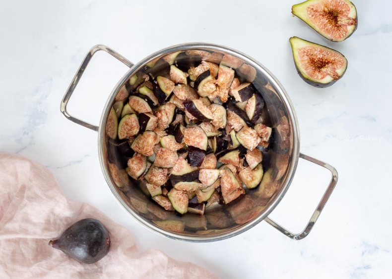 Fig jam ingredients added to a pot