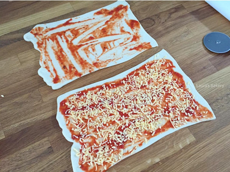Shredded cheese added to pizza dough
