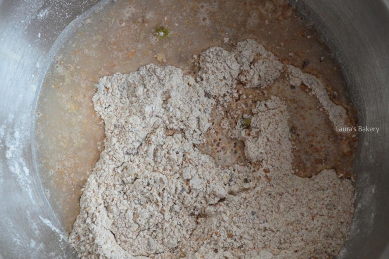 Spelt seed cracker ingredients in a mixing bowl