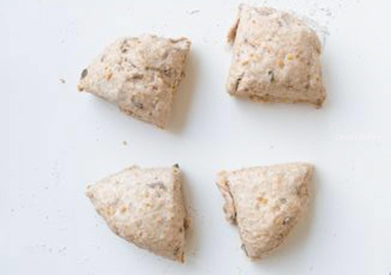 Multigrain bagel dough in four equal pieces