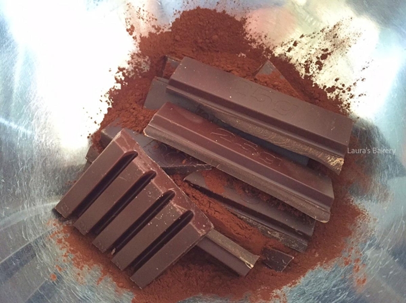 Cocoa powder and dark chocolate in a mixing bowl for Oreo bundt cake.