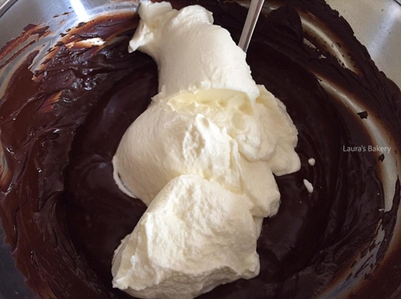 Sour cream added to the melted chocolate mixture for making Oreo bundt cake.